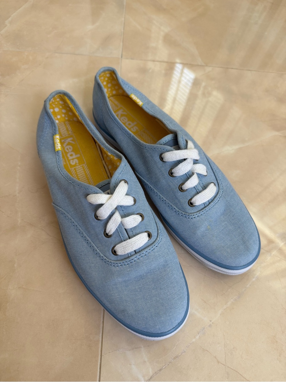 light blue canvas Keds lace-up sneakers